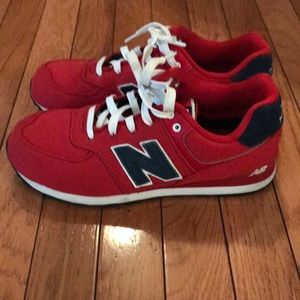 Men’s Red New Balance sneakers.